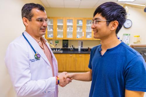 doctor shaking hands with patient